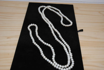 white NA opera necklace