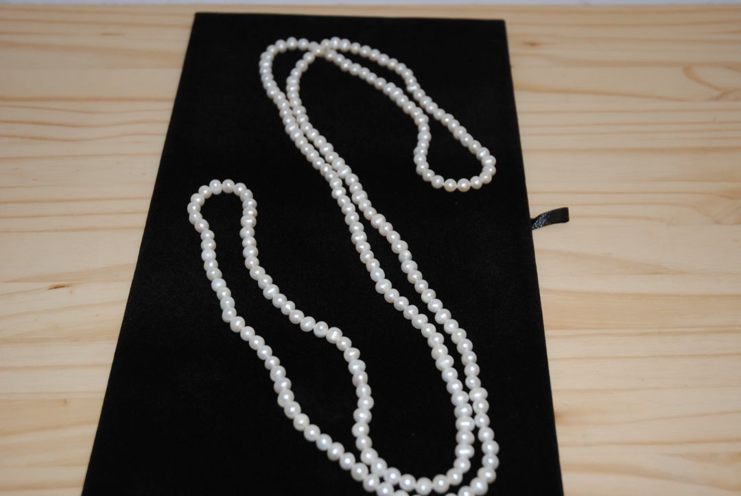 white NA opera necklace