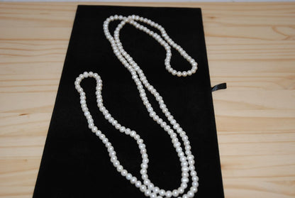 white NA opera necklace