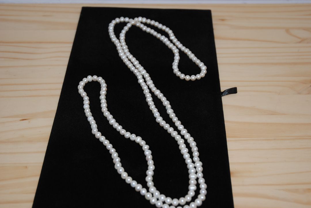 white NA opera necklace