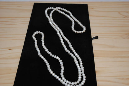 white NA opera necklace