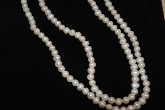white NA opera necklace