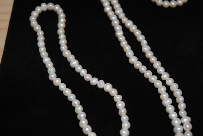 white NA opera necklace
