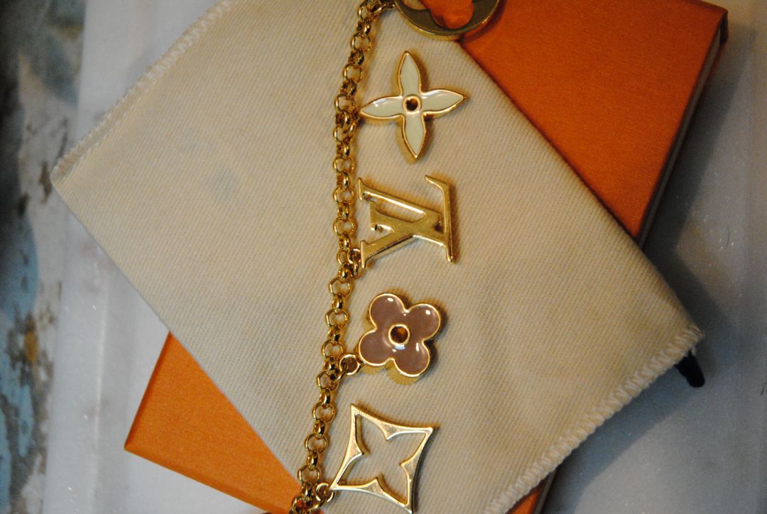 gold Louis Vuitton bag chain extender