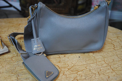 gray blue Prada re-edition 2005 saffiano leather shoulder bag with matching pouch