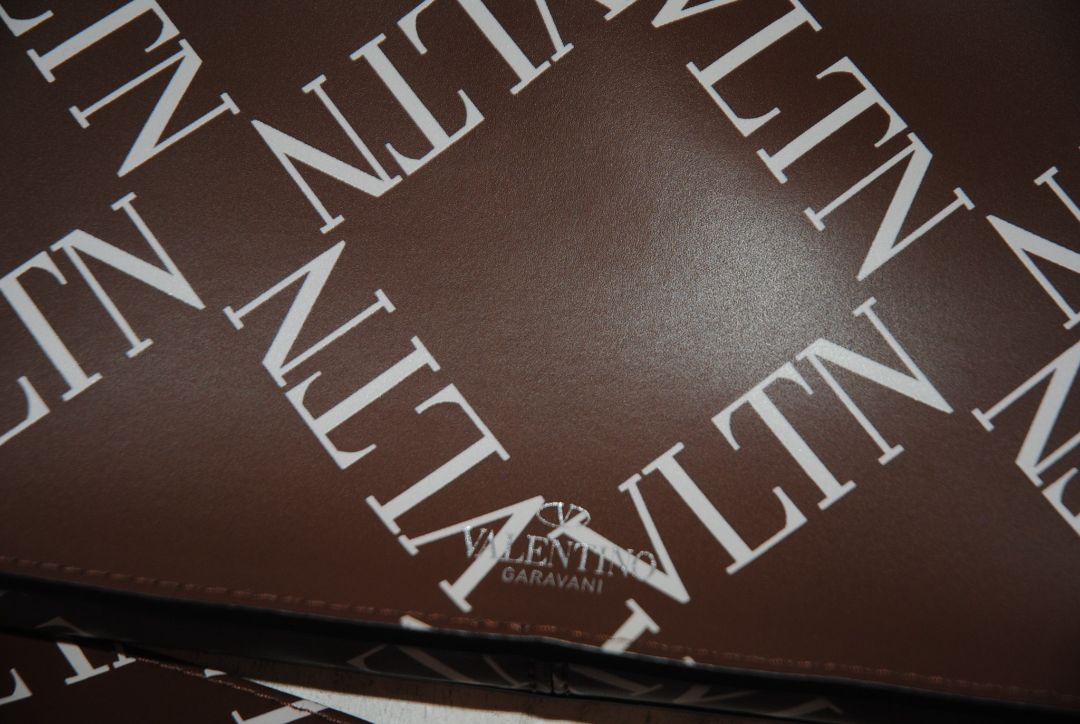 brown and white Valentino Logo leather crossbody bag