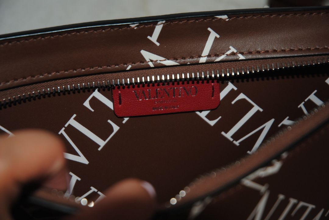 brown and white Valentino Logo leather crossbody bag