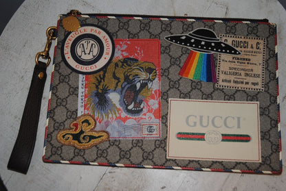 monogram Gucci supreme zip pouch wristlet