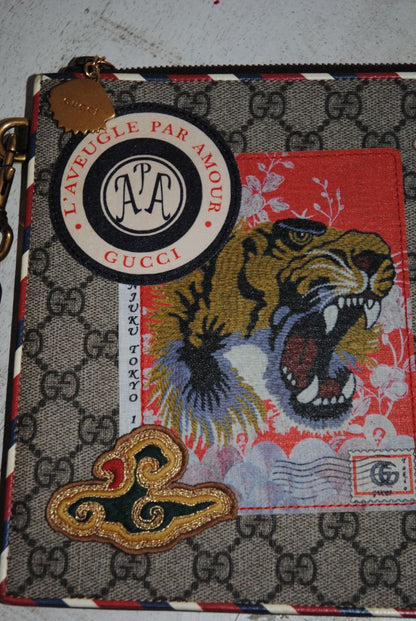 monogram Gucci supreme zip pouch wristlet