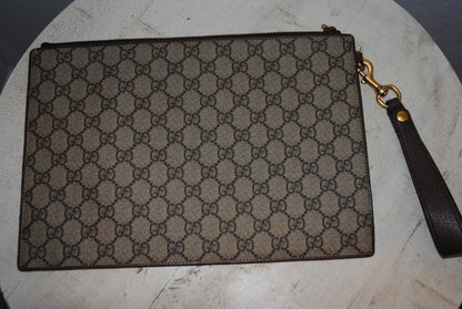 monogram Gucci supreme zip pouch wristlet