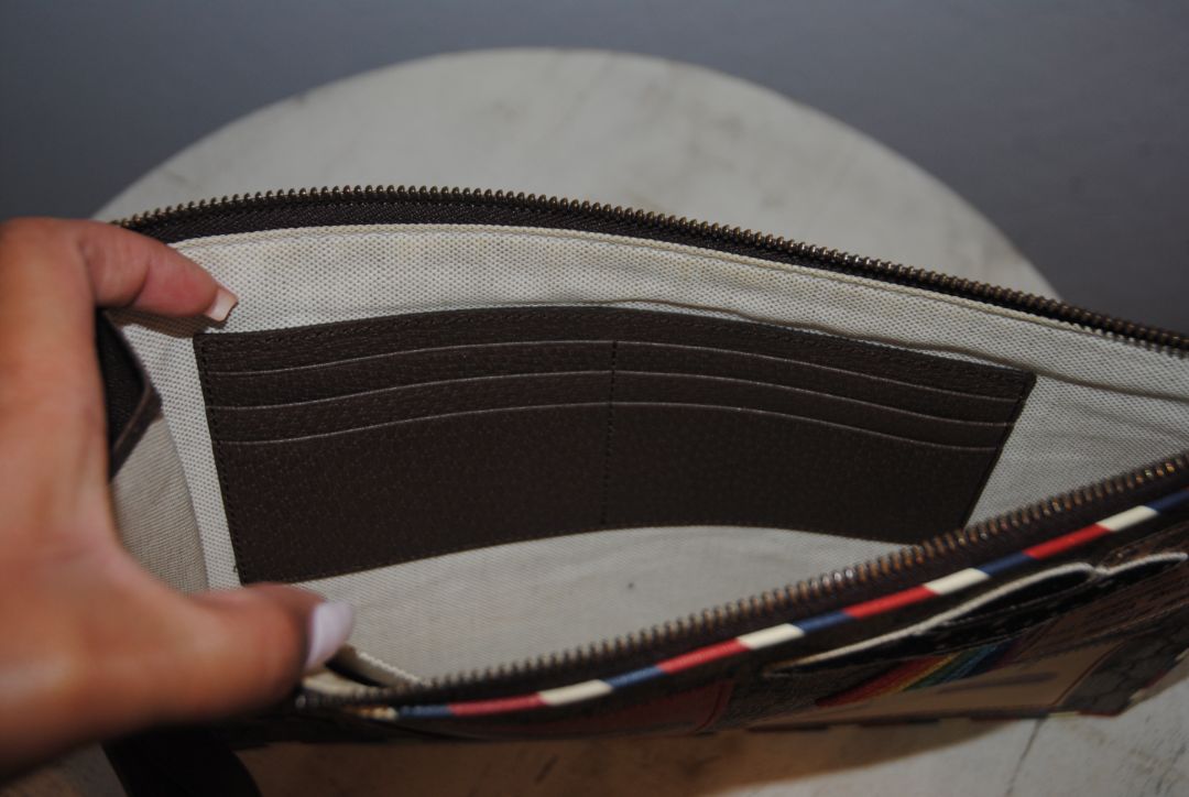 monogram Gucci supreme zip pouch wristlet