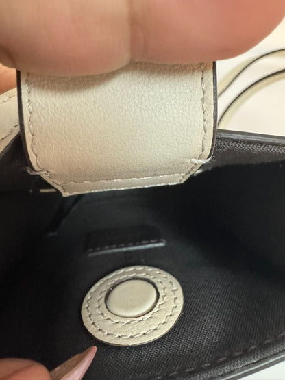 Fendi Fendigraphy Cellphone Pouch in signature FF monogram, featuring a sleek design with a detachable strap, gold-tone hardware, and a compact, functional interior to hold your phone and essentials.