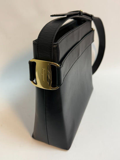 navy blue Ferragamo shoulder bag, Dimensions (Approximate): Height: 9” (22.9 cm) Width: 11.5” (29.2 cm) Depth: 4” (10.2 cm) Strap Drop: Adjustable from 10” to 13” (25.4 to 33 cm)
