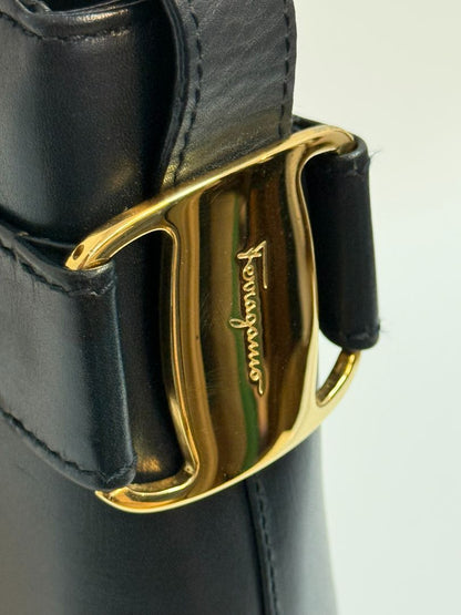 navy blue Ferragamo shoulder bag, Dimensions (Approximate): Height: 9” (22.9 cm) Width: 11.5” (29.2 cm) Depth: 4” (10.2 cm) Strap Drop: Adjustable from 10” to 13” (25.4 to 33 cm)