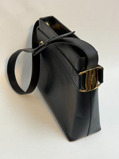 navy blue Ferragamo shoulder bag, Dimensions (Approximate): Height: 9” (22.9 cm) Width: 11.5” (29.2 cm) Depth: 4” (10.2 cm) Strap Drop: Adjustable from 10” to 13” (25.4 to 33 cm)