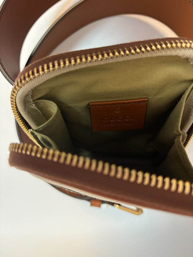 tan and white Gucci belt bag, 4x 6.5 x 1