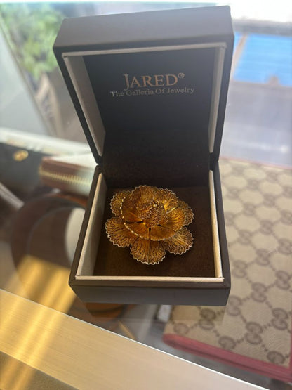 gold tone Jared brooch, Dimensions (Estimated from visual cues) • Diameter: ~2 inches (5.08 cm) • Height: ~1 inch (2.54 cm) • Weight: Unknown, but likely lightweight due to filigree structure