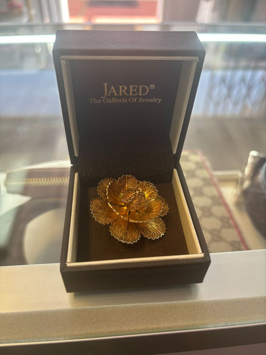 gold tone Jared brooch, Dimensions (Estimated from visual cues) • Diameter: ~2 inches (5.08 cm) • Height: ~1 inch (2.54 cm) • Weight: Unknown, but likely lightweight due to filigree structure