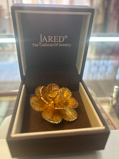 gold tone Jared brooch, Dimensions (Estimated from visual cues) • Diameter: ~2 inches (5.08 cm) • Height: ~1 inch (2.54 cm) • Weight: Unknown, but likely lightweight due to filigree structure