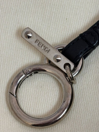 purple and green FENDI fur “monster” bag charm, pom-pom diameter: 10 cm (4 in) Total hanging drop (ring + strap + fur): ~20 cm (8 in)