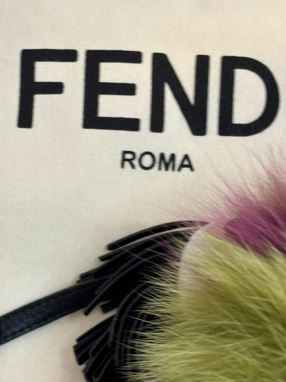 purple and green FENDI fur “monster” bag charm, pom-pom diameter: 10 cm (4 in) Total hanging drop (ring + strap + fur): ~20 cm (8 in)