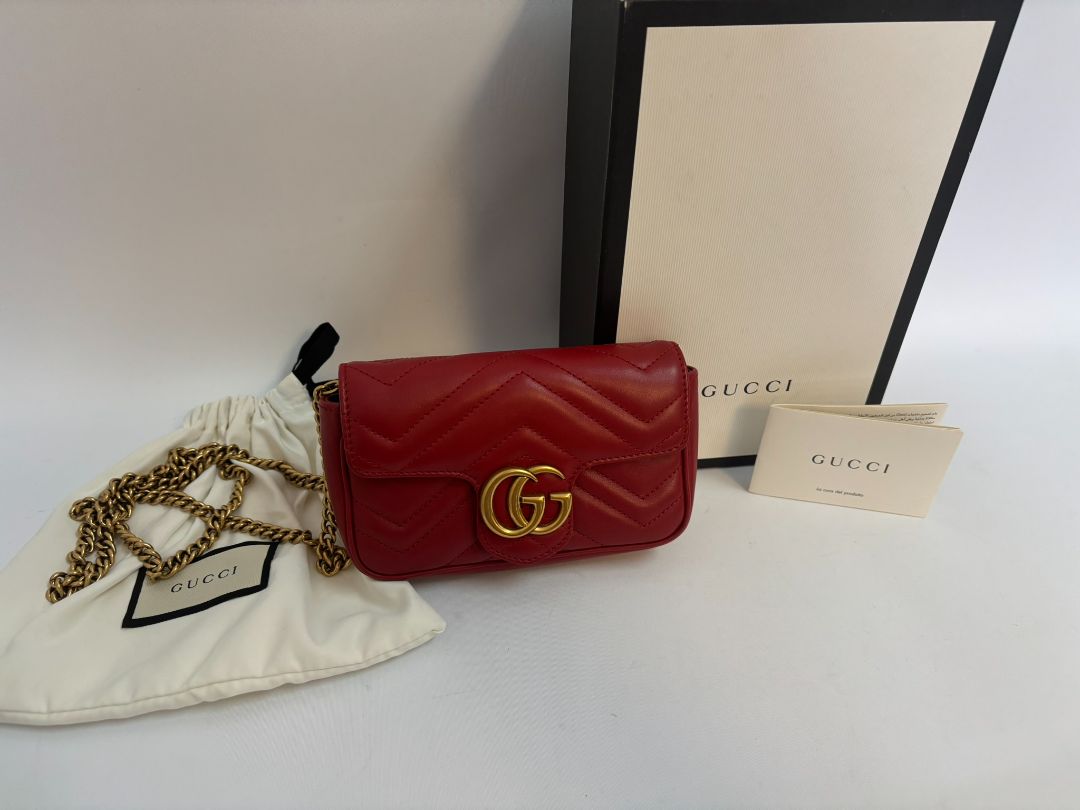 red GUCCI super Mini Bag Matelassé Leather, Width: 6.2 in (16 cm) Height: 4 in (10.2 cm) Depth: 1.8 in (4.6 cm) Chain Drop: 22 in (crossbody)