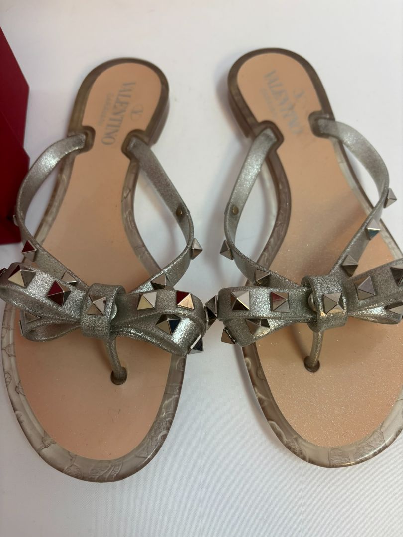 silver Valentino Garavani Rockstud Jelly Bow Thong Sandals, 37/ DIMENSIONS (Size EU 39 / US 9) Footbed Length: ~10.5 in Heel Height: Flat (~0.25 in molded heel)