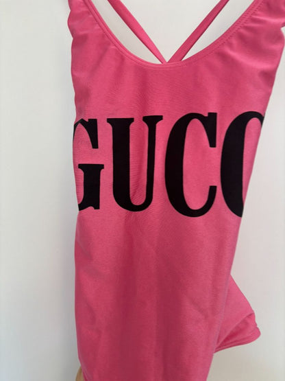 pink GUCCI One-Piece Logo Swimsuit, (Size S): Length (top to bottom): ~25–27 in Bust (unstretched): ~12 in Waist: ~11 in