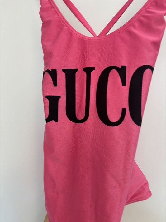 pink GUCCI One-Piece Logo Swimsuit, (Size S): Length (top to bottom): ~25–27 in Bust (unstretched): ~12 in Waist: ~11 in