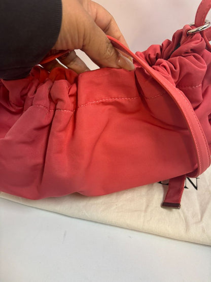 red Alexander McQueen drawstring bag, Length: 10 in Height: 6 in Depth: 3.5 in Strap Drop: Adjustable (approx. 12–20 in)