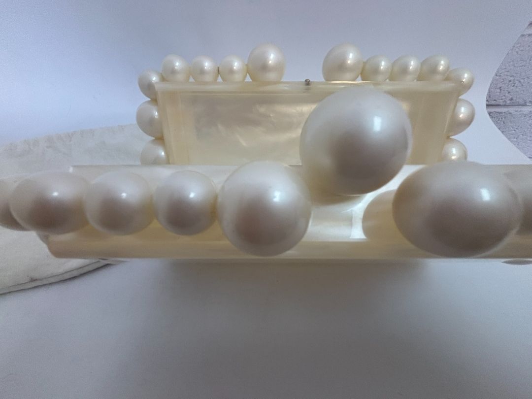 pearl Cult Gaia EOS pearl acrylic clutch, Width: 7.5 inches Height: 5 inches Depth: 2 inches