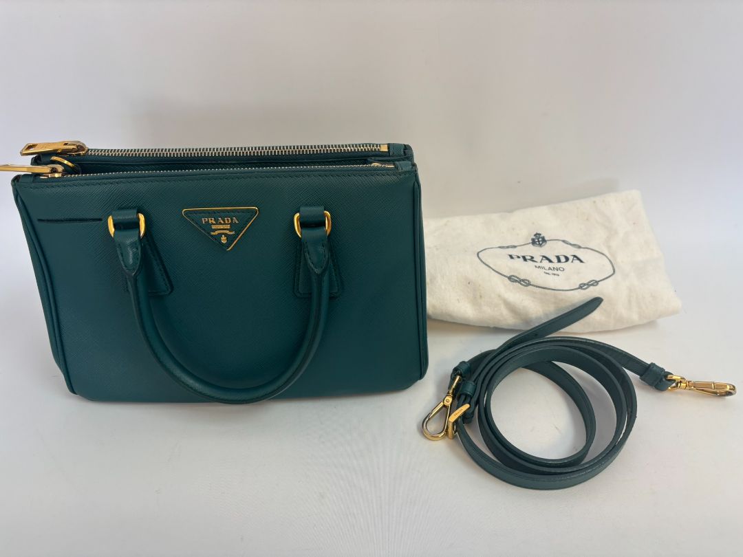 deep teal Prada Model: Double Zip Lux Tote (also known as Galleria Tote), Width: 11.5 inches (29 cm) Height: 8 inches (20 cm) Depth: 5 inches (13 cm) Handle Drop: 4 inches (10 cm) Strap Drop: 19–21 inches adjustable (48–53 cm)