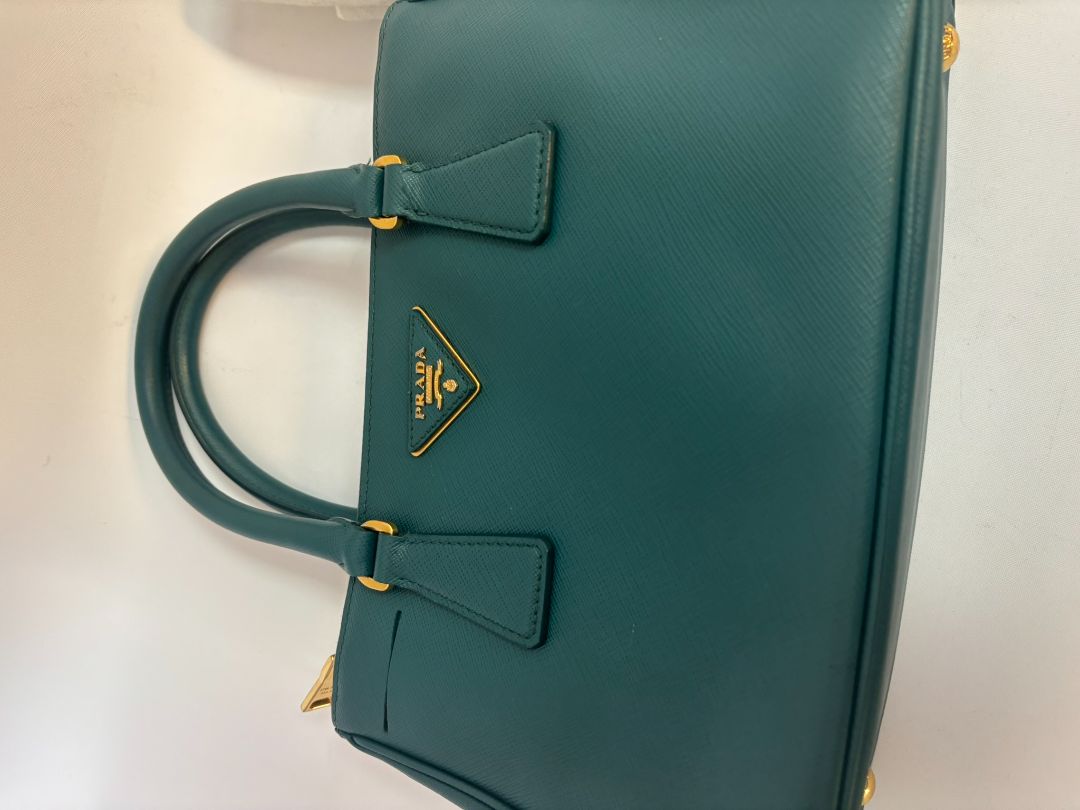 deep teal Prada Model: Double Zip Lux Tote (also known as Galleria Tote), Width: 11.5 inches (29 cm) Height: 8 inches (20 cm) Depth: 5 inches (13 cm) Handle Drop: 4 inches (10 cm) Strap Drop: 19–21 inches adjustable (48–53 cm)