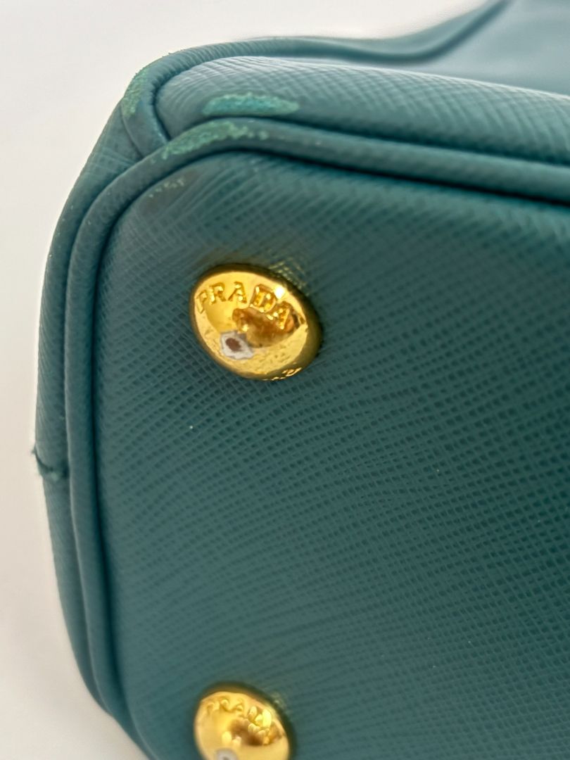 deep teal Prada Model: Double Zip Lux Tote (also known as Galleria Tote), Width: 11.5 inches (29 cm) Height: 8 inches (20 cm) Depth: 5 inches (13 cm) Handle Drop: 4 inches (10 cm) Strap Drop: 19–21 inches adjustable (48–53 cm)