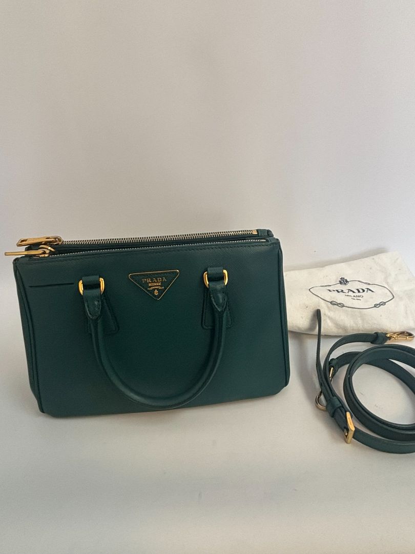 deep teal Prada Model: Double Zip Lux Tote (also known as Galleria Tote), Width: 11.5 inches (29 cm) Height: 8 inches (20 cm) Depth: 5 inches (13 cm) Handle Drop: 4 inches (10 cm) Strap Drop: 19–21 inches adjustable (48–53 cm)