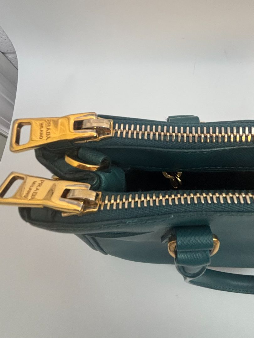 deep teal Prada Model: Double Zip Lux Tote (also known as Galleria Tote), Width: 11.5 inches (29 cm) Height: 8 inches (20 cm) Depth: 5 inches (13 cm) Handle Drop: 4 inches (10 cm) Strap Drop: 19–21 inches adjustable (48–53 cm)