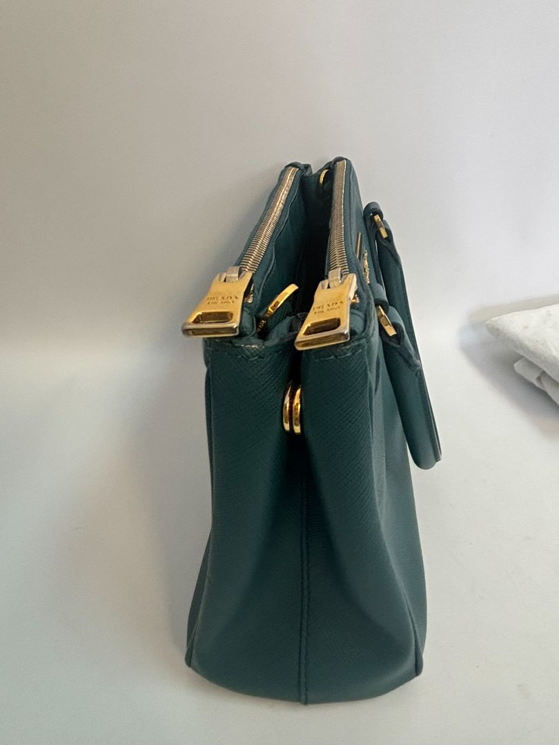deep teal Prada Model: Double Zip Lux Tote (also known as Galleria Tote), Width: 11.5 inches (29 cm) Height: 8 inches (20 cm) Depth: 5 inches (13 cm) Handle Drop: 4 inches (10 cm) Strap Drop: 19–21 inches adjustable (48–53 cm)