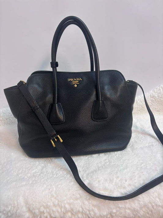 black PRADA top handle calfskin with strap, Width: 13.5–14 in (34–36 cm) Height: 10–10.5 in (25–27 cm) Depth: 6 in (15 cm) Handle Drop: ~4.5 in Shoulder Strap Drop: ~20–22 in (adjustable, detachable)