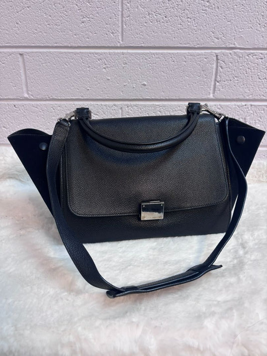 black Celine Trapeze, Width: 12” (expands to ~20” with wings out) Height: 9” Depth: 7” Top Handle Drop: 4.5” Shoulder Strap Drop: 15–18” adjustable