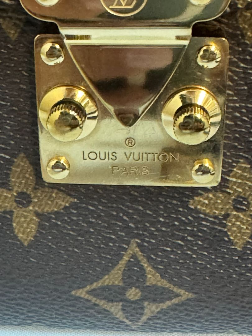Louis Vuitton Pochette Métis in Monogram canvas, featuring the iconic LV logo print, a structured flap design, gold-tone hardware, and a detachable shoulder strap for versatile wear. This elegant crossbody bag is perfect for both day and night occasions.