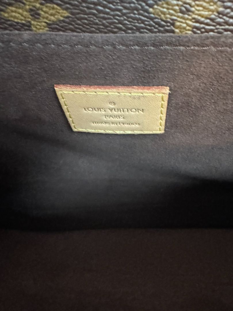 Louis Vuitton Pochette Métis in Monogram canvas, featuring the iconic LV logo print, a structured flap design, gold-tone hardware, and a detachable shoulder strap for versatile wear. This elegant crossbody bag is perfect for both day and night occasions.