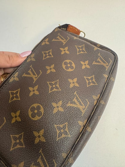 Louis Vuitton Pochette Monogram clutch bag with iconic brown monogram canvas and gold-tone hardware.