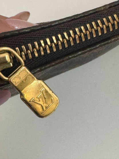 Louis Vuitton Pochette Monogram clutch bag with iconic brown monogram canvas and gold-tone hardware.