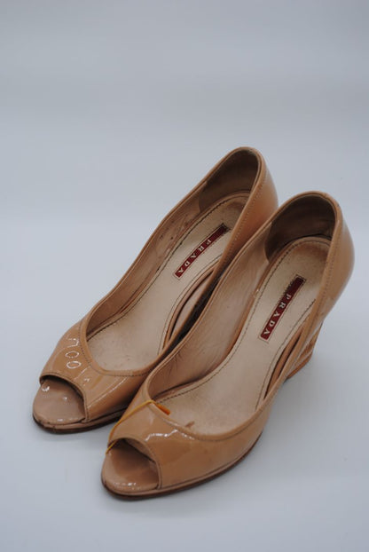 Elegant nude Prada pumps with block heel for women