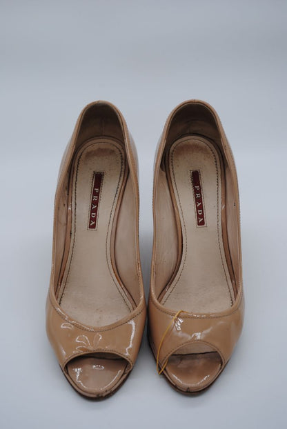 Round toe nude Prada block heels made in Italy