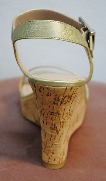 Rear view showing wedge heel height and gold texture

